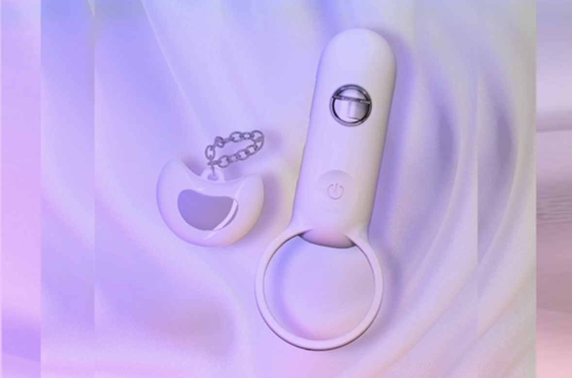 Close-up of a lilac-colored G-spot vibrator with a curved shape, sitting on soft purple fabric, highlighting its ergonomic design for intimate stimulation.