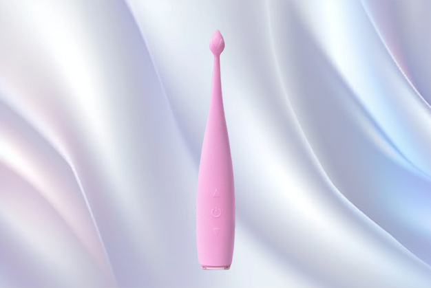 Sleek pink vibrator with a slender, curved shape resting on smooth white fabric, showcasing its ergonomic design for targeted pleasure.